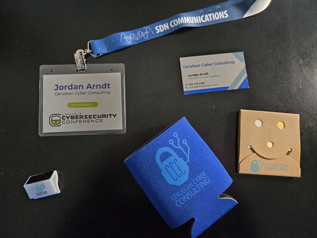 Jordan Arndt as a speaker at the Sioux Falls Cybersecurity Conference with Cerulean Cyber Consulting branded materials